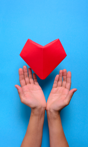 Heart hands blue background