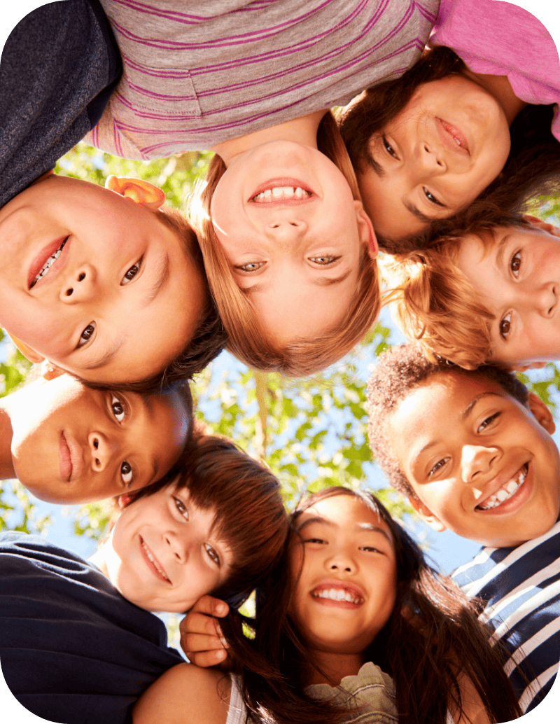 Kid faces in a huddle