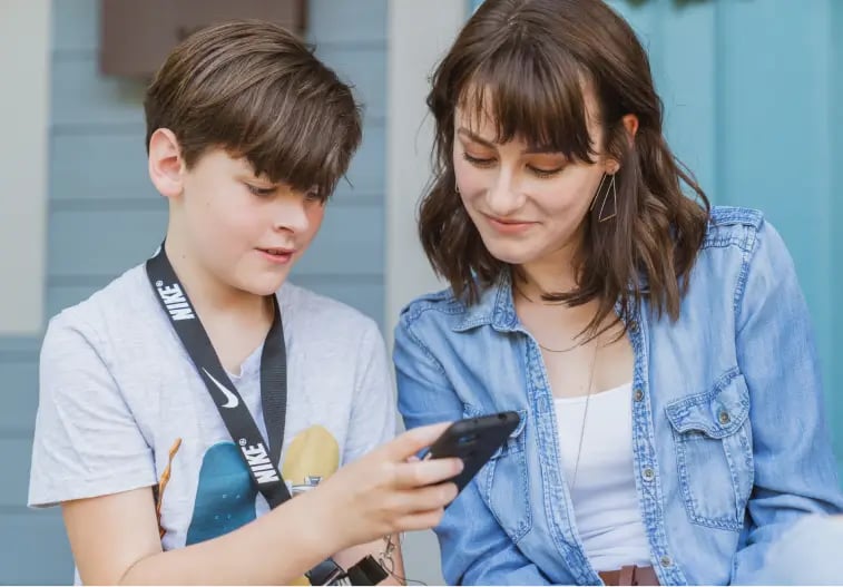 Mom and boy looking at phone_1 (1)