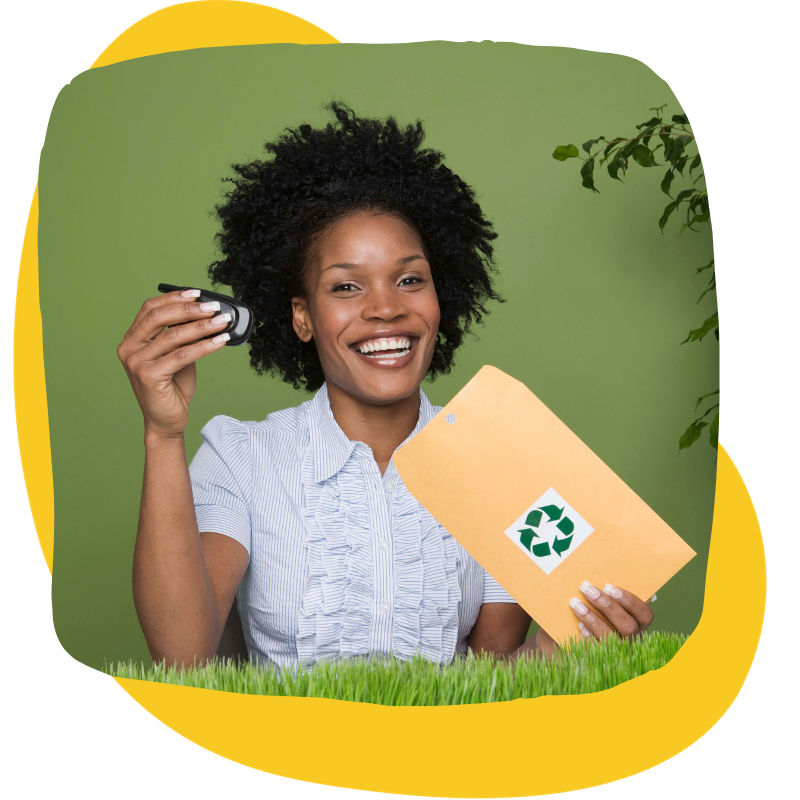 Woman putting phone in envelope for recycling