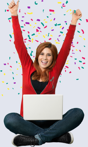 Woman with laptop and confetti